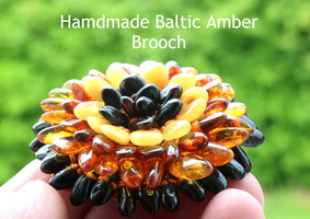 Coloured amber beads set in flower shape