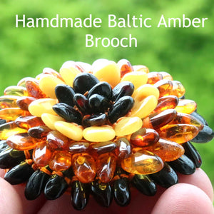 Coloured amber beads set in flower shape