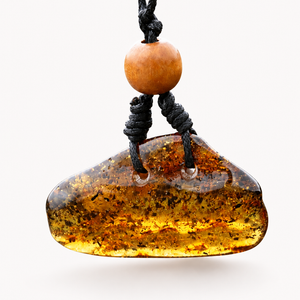 A natural amber stone pendant necklace with a black cord and a single light brown wooden bead, shown against a plain white background.