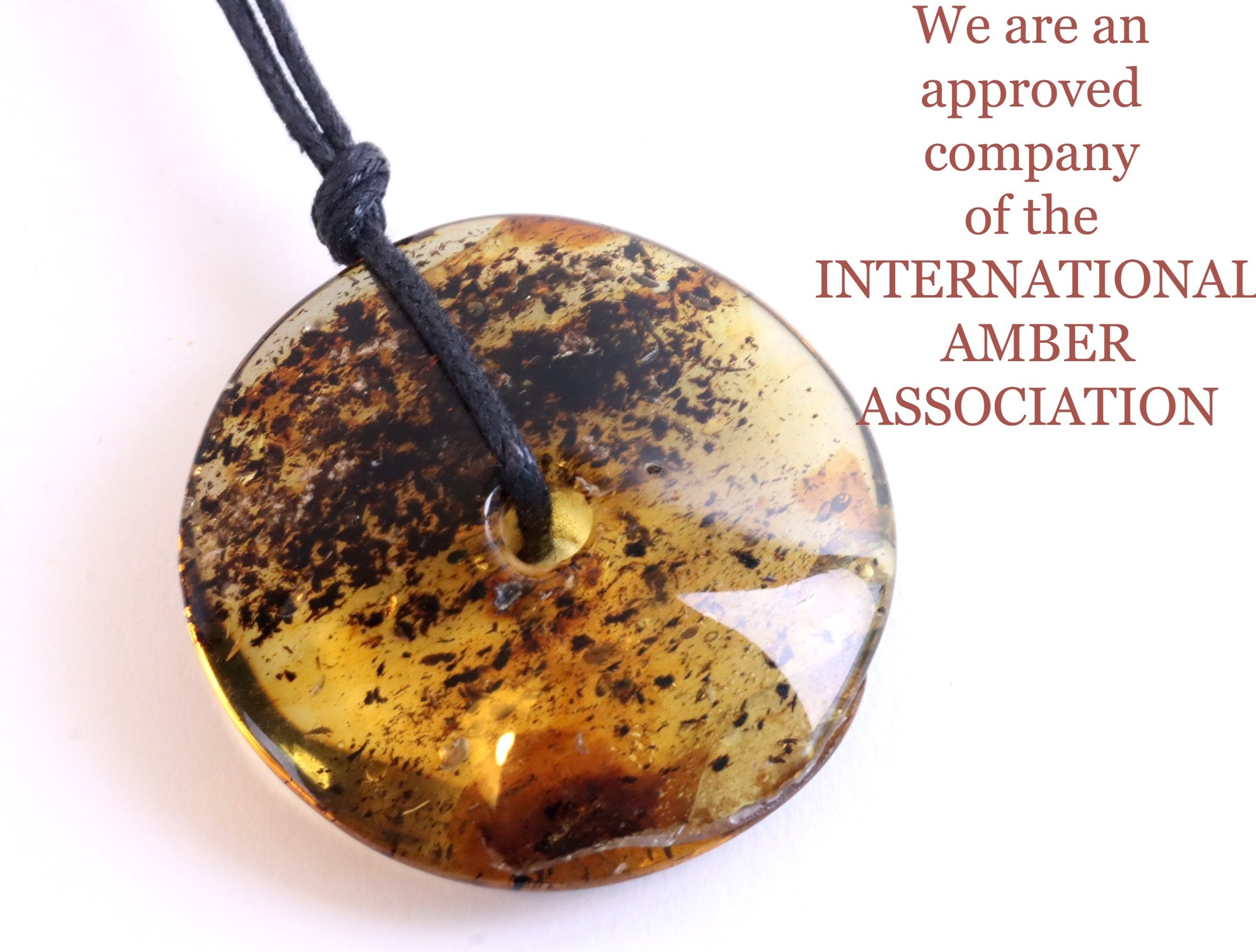 Large Baltic Amber Donut Amulet Pendant