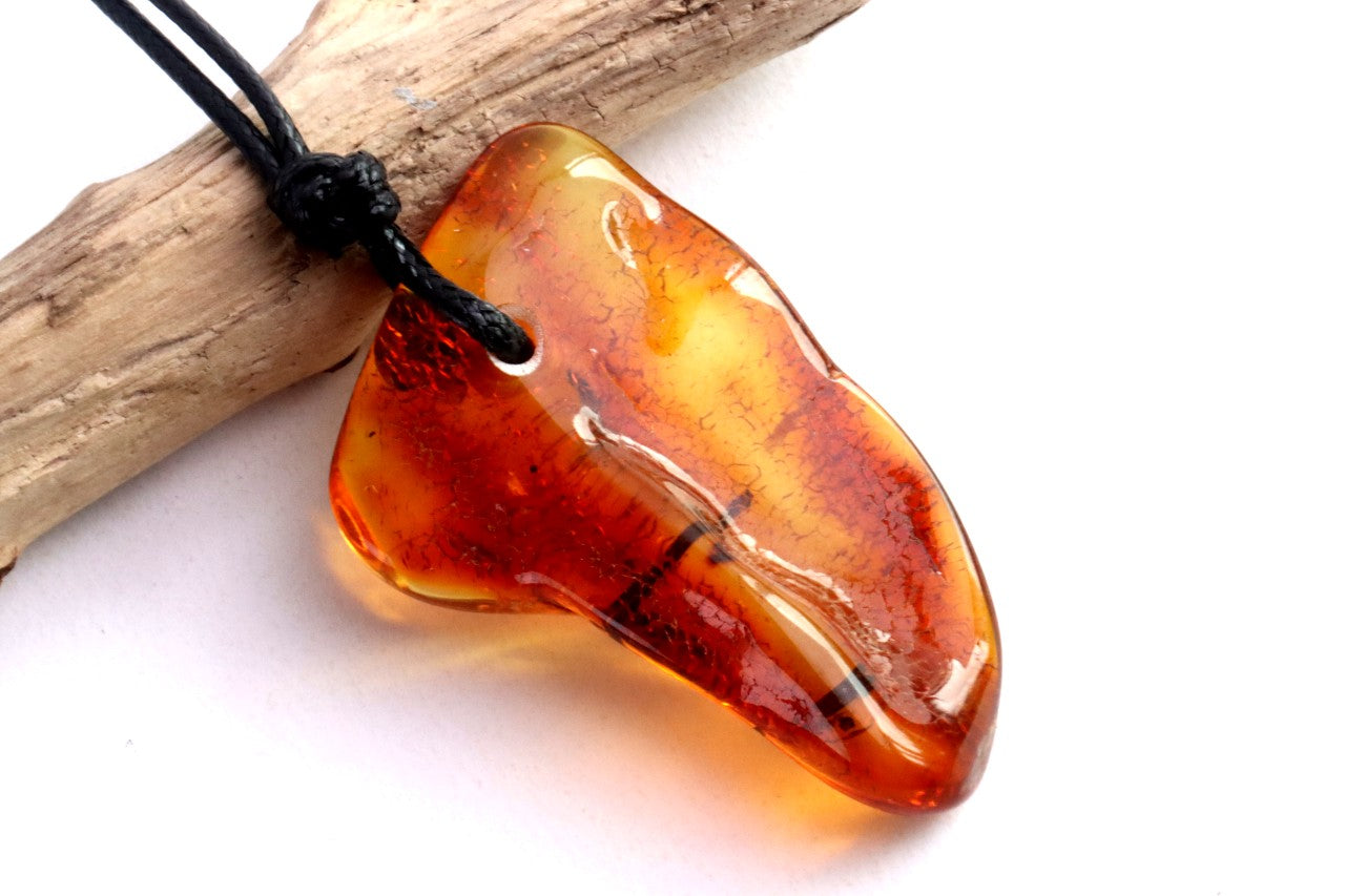 Amber Amulet with Natural Fossilised Tree Branch Inclusion
