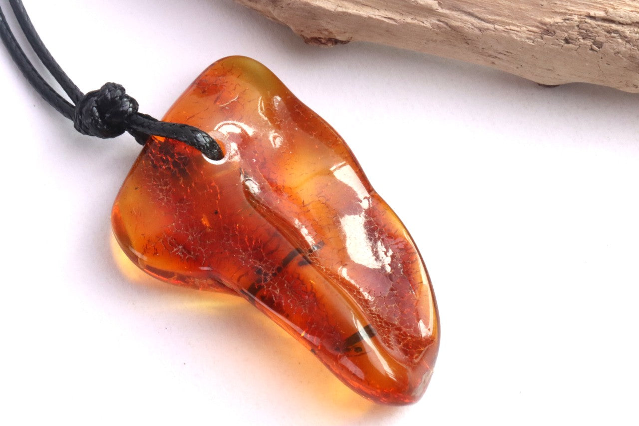 Amber Amulet with Natural Fossilised Tree Branch Inclusion