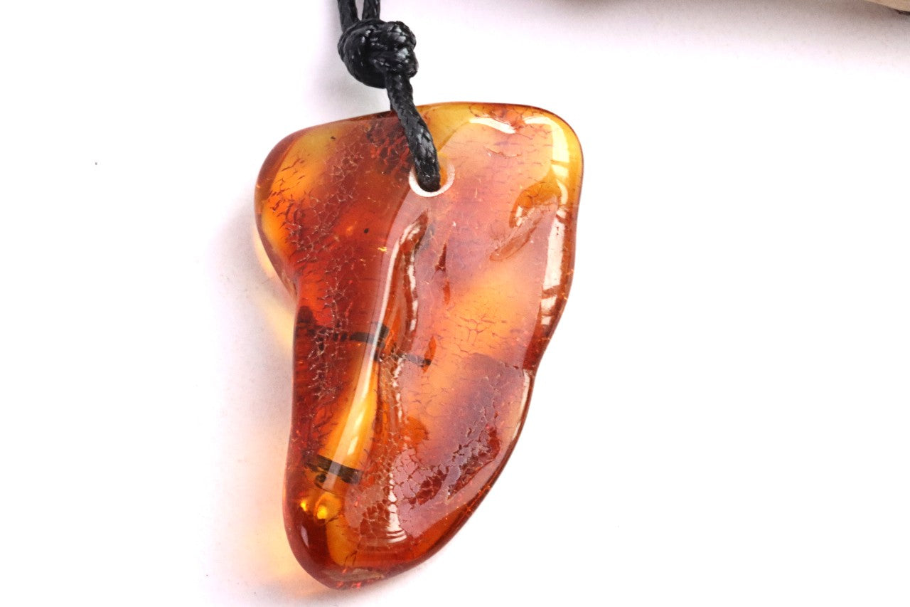 Amber Amulet with Natural Fossilised Tree Branch Inclusion