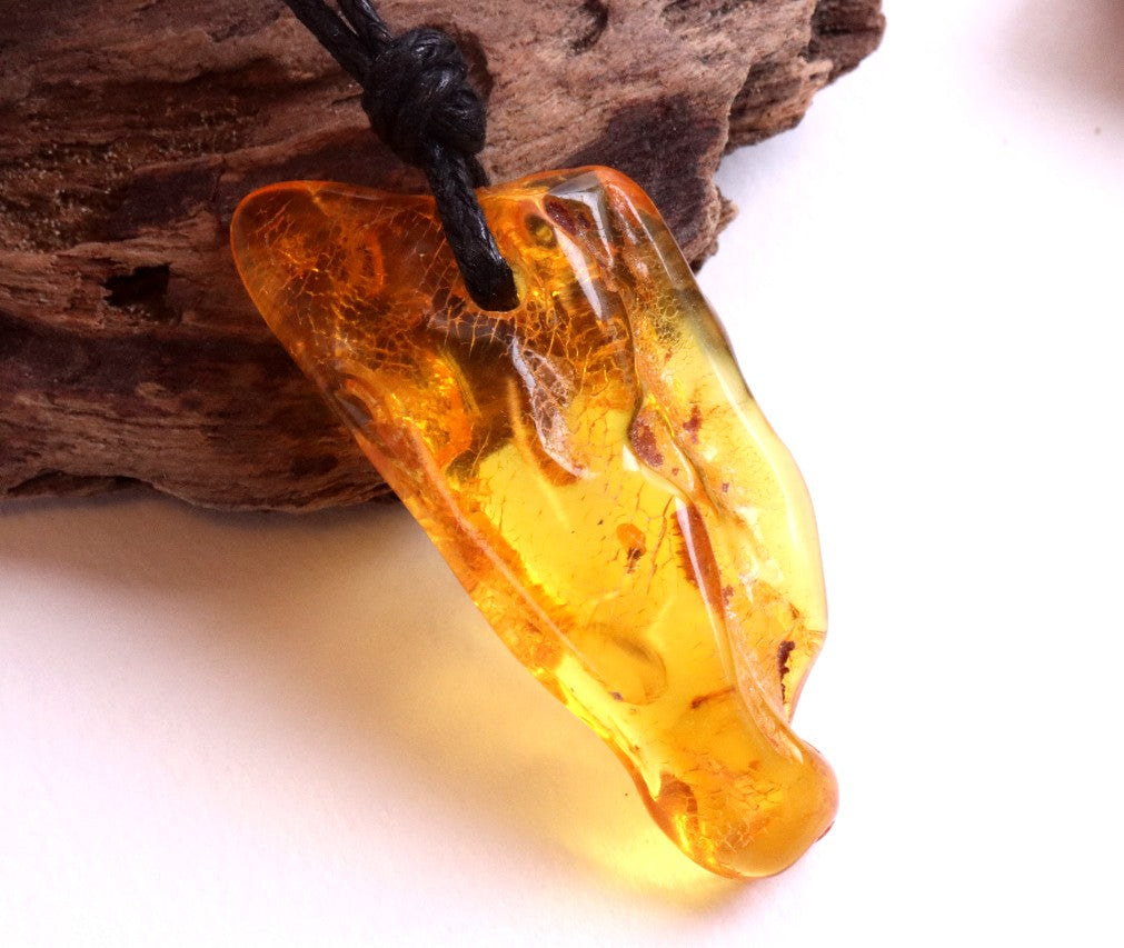 40 million year old Natural Amber Amulet With Fly Inclusion