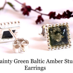 Dainty green amber stud earrings on a white background with text.