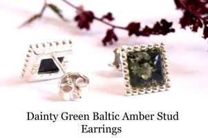 Dainty green amber stud earrings on a white background with text.