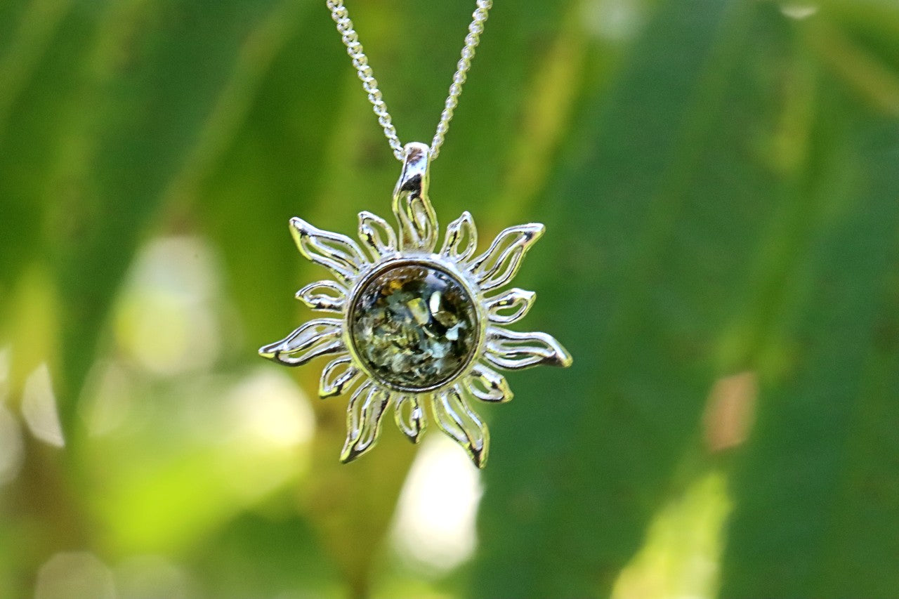 Radiant Sun Pendant – 925 Sterling Silver with Green Baltic Amber