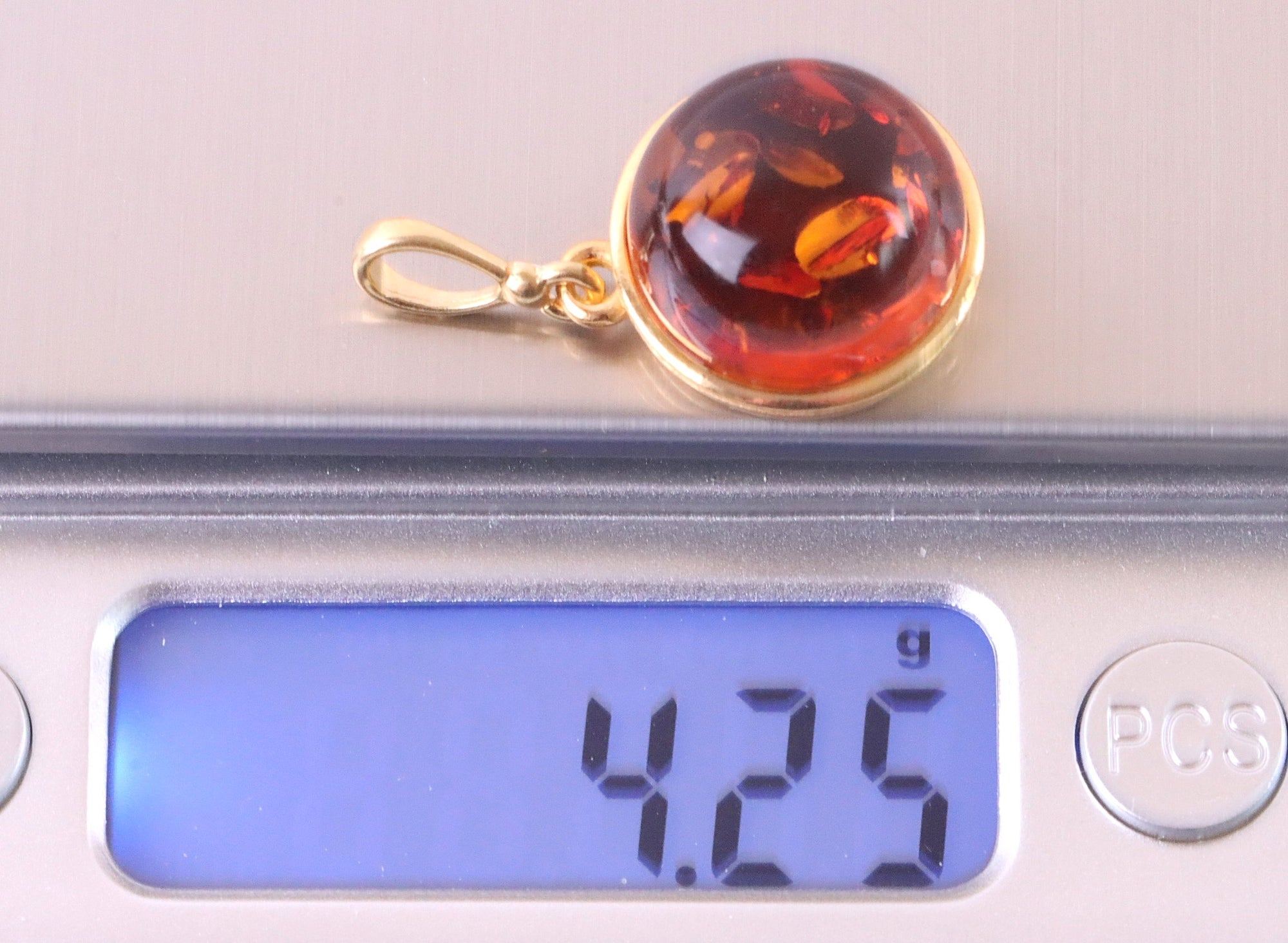 pendant on scales