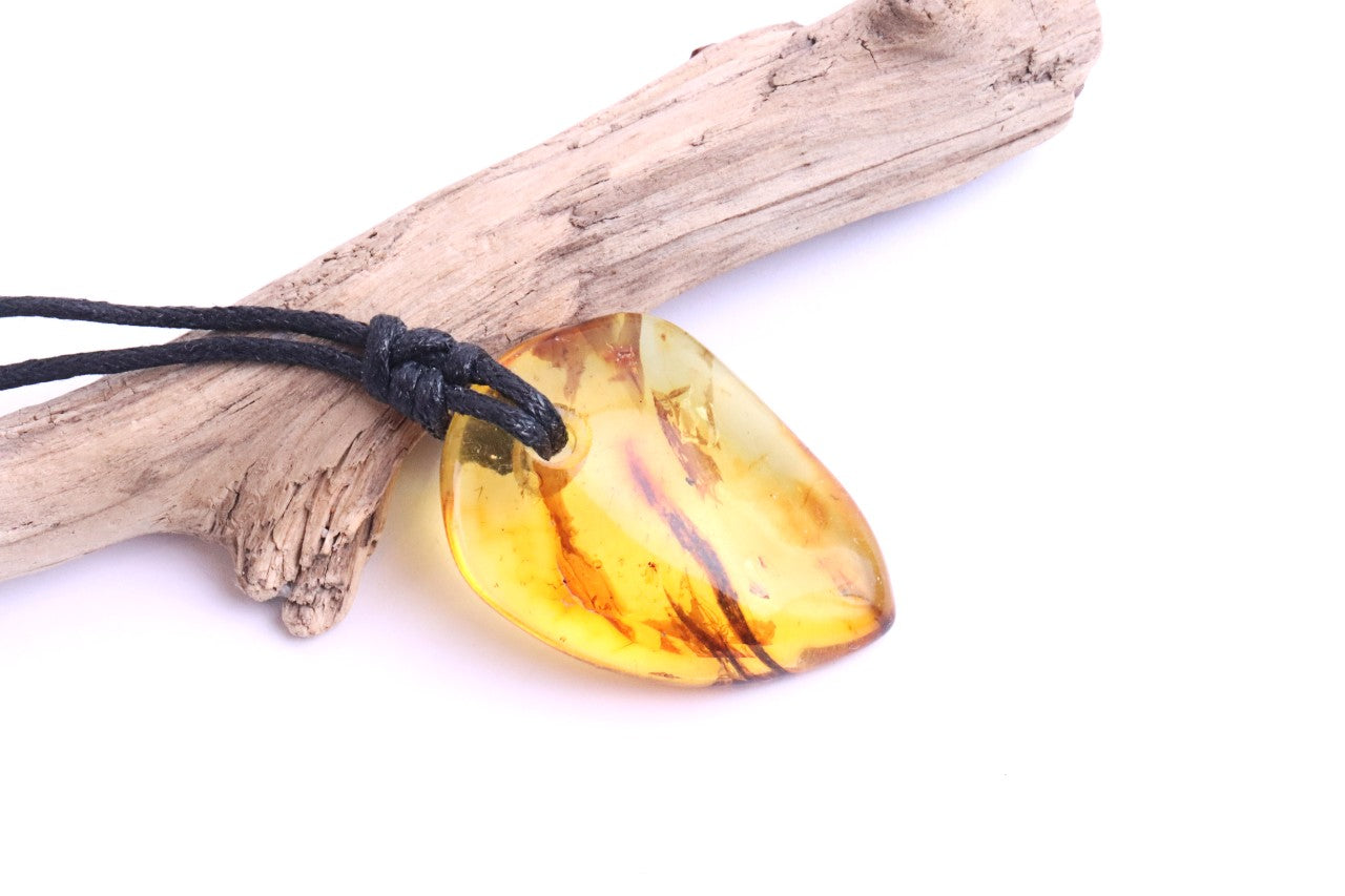 Baltic Amber Amulet, Carry the sun’s warmth and nature’s power wherever you go.