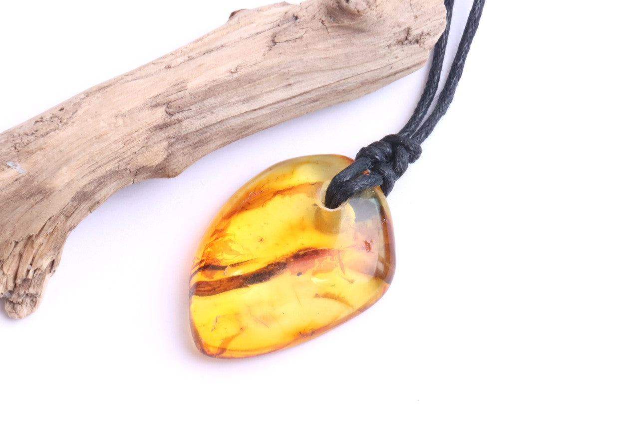 Baltic Amber Amulet, Carry the sun’s warmth and nature’s power wherever you go.