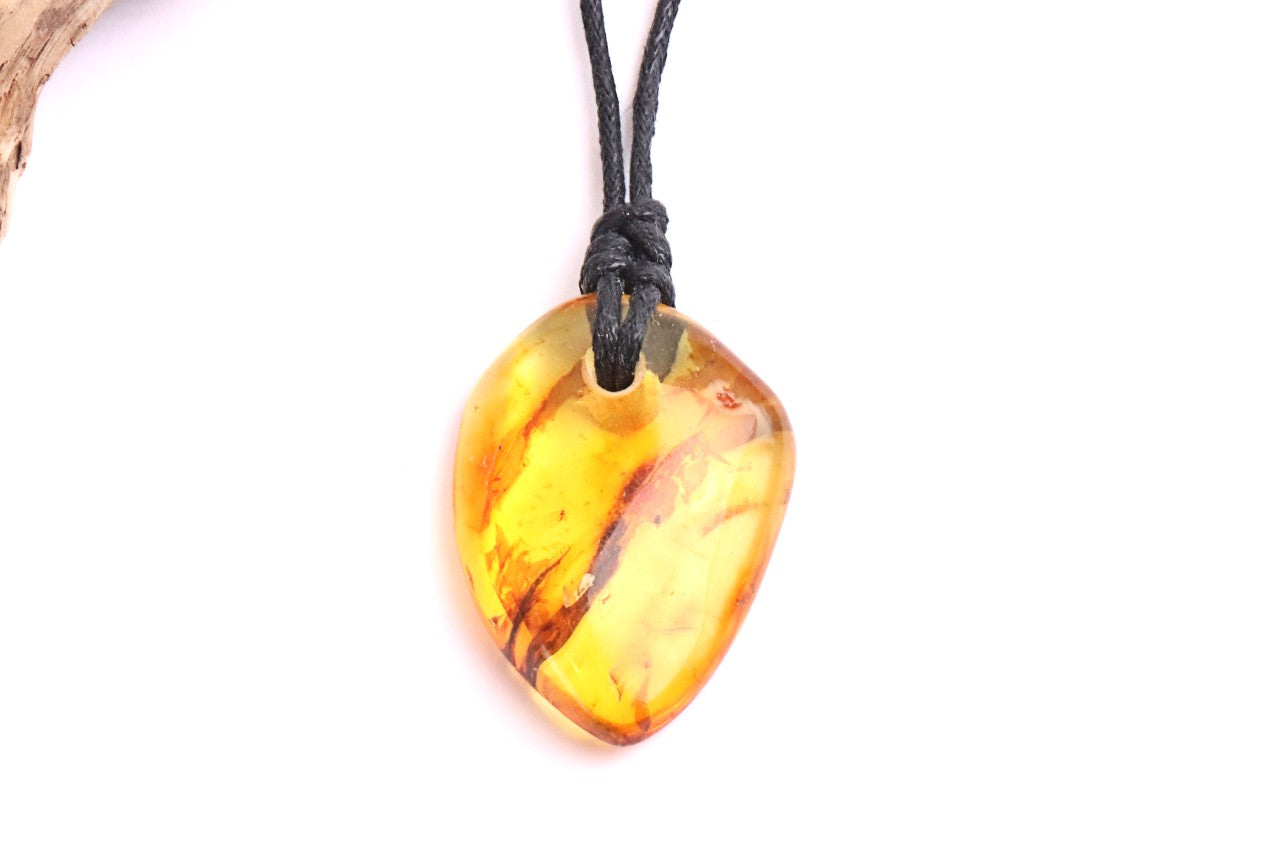 Baltic Amber Amulet, Carry the sun’s warmth and nature’s power wherever you go.