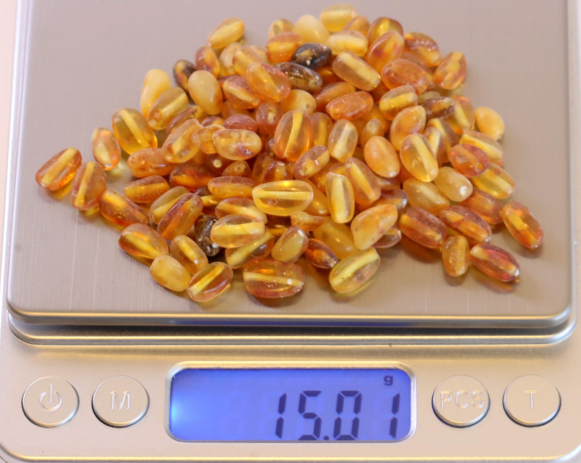 Semi Polished Bean Shaped Amber Beads - 100 beads in 15 grams