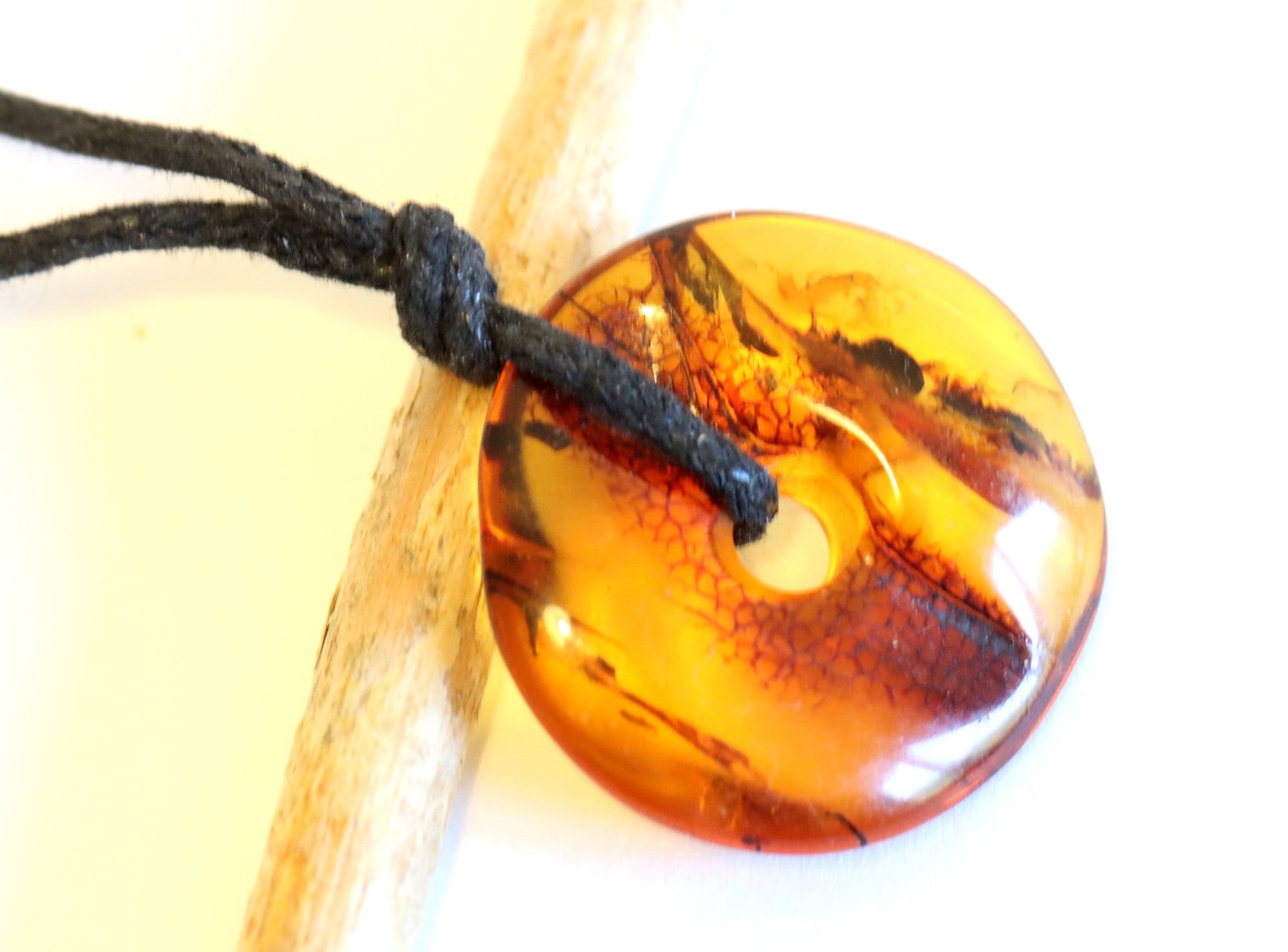 Polished Dainty Amber Donut Amulet