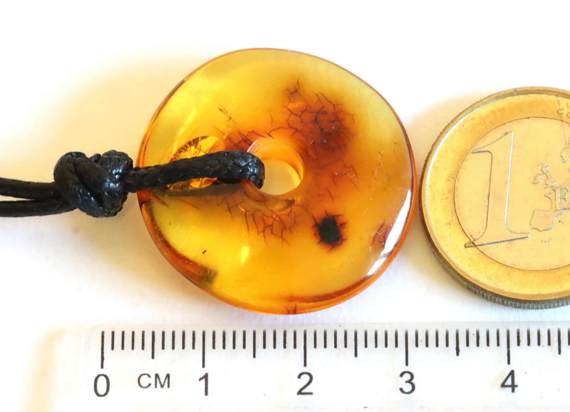 Polished Dainty Amber Donut Amulet