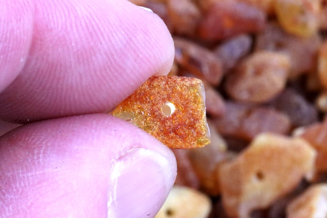 Raw Flat Baltic Amber Beads with holes/ (10mm-6mm) Approx 100 amber beads in each 15 grams