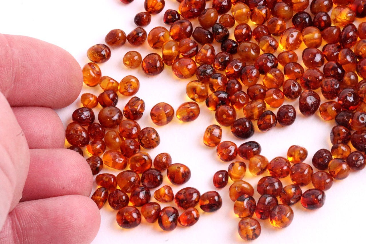 Baltic Amber Beads with holes 5mm X 4mm Approx 150 amber beads in each 15 grams