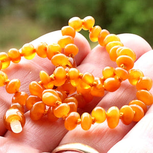 Amber necklace in the hand